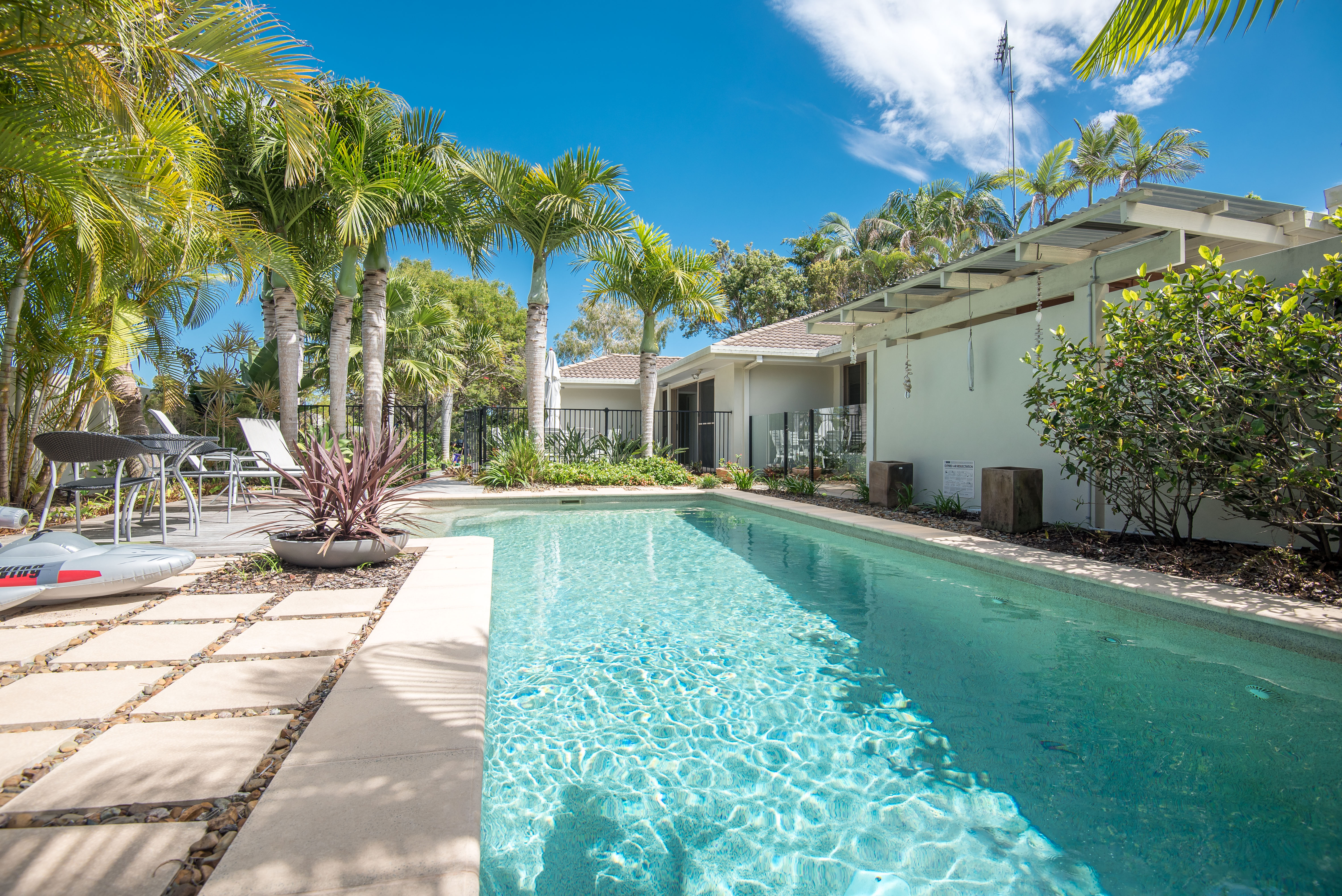 A large swimming pool in the backyard of a holiday rental in Sunrise Beach Queensland
